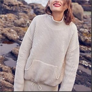 J. Crew 100% Merino Wool Front pocket turtleneck sweater. Ivory gently worn